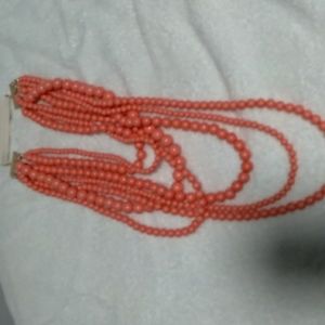 7 strand beaded necklace. Light coral color